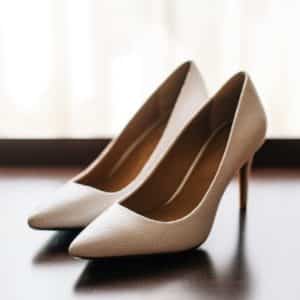 pair of women's brown pointed-toe pumps on board